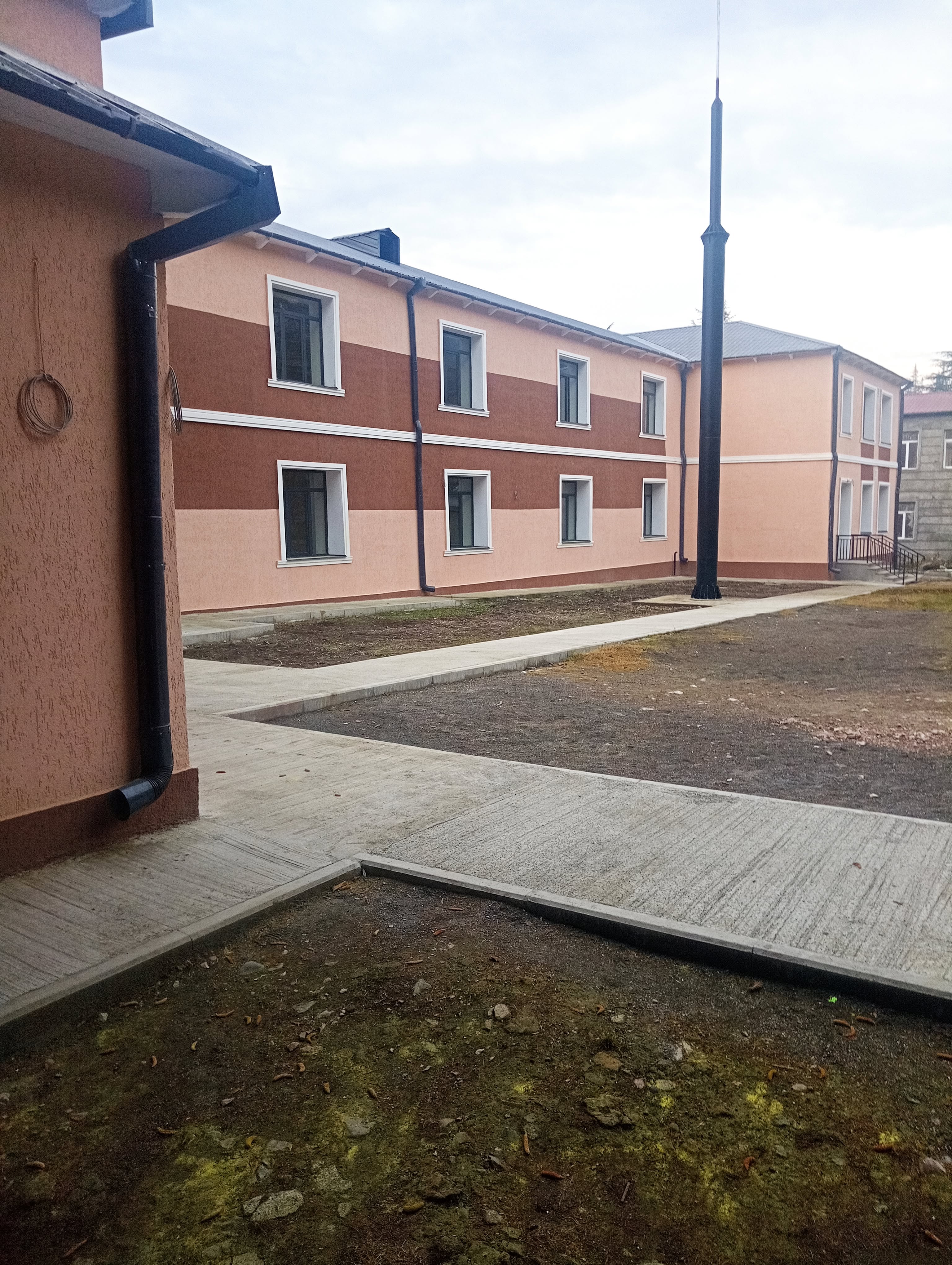School courtyard and renovated building exterior