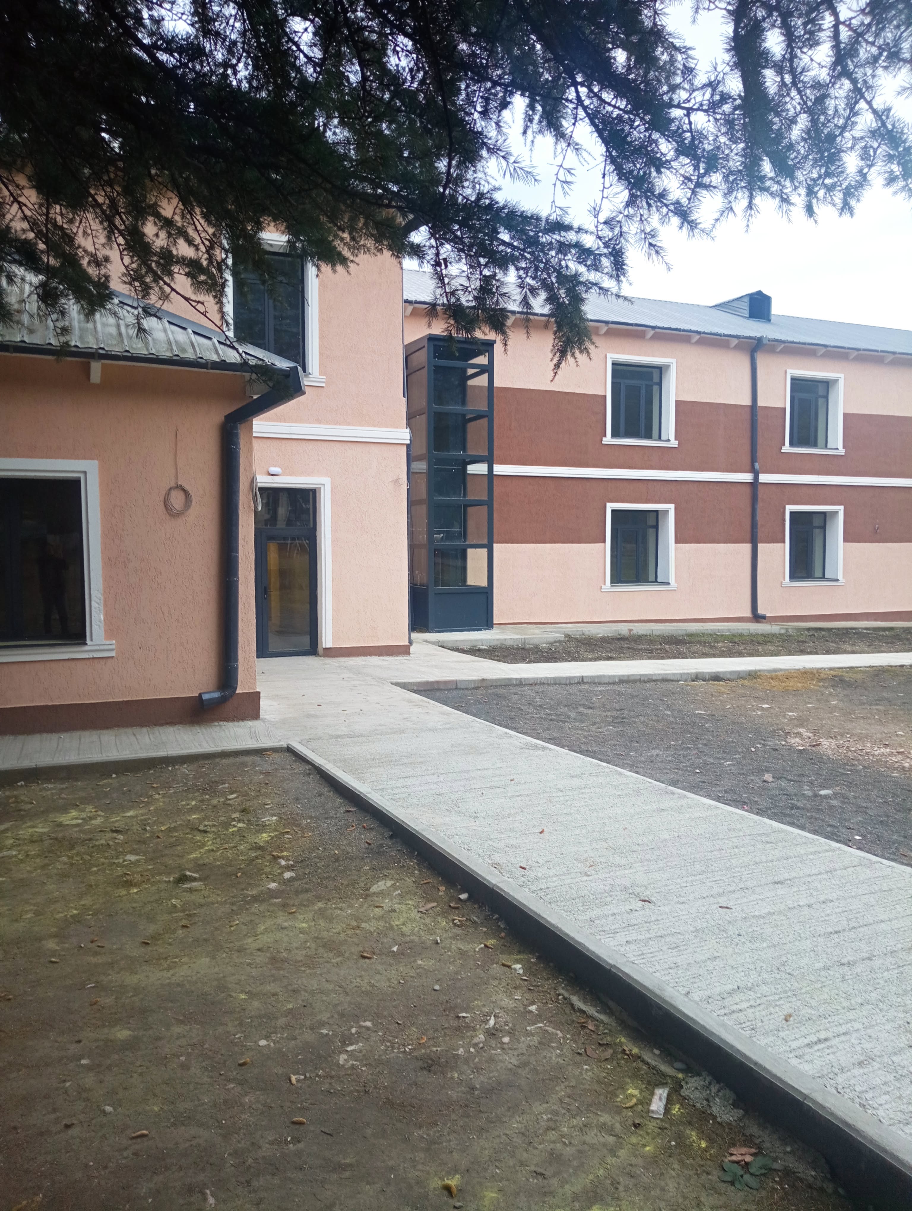 School building exterior with accessibility elevator